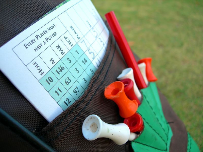 golf tees and scorecard