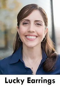 Smiling woman wearing hoop earrings as examples of illusory correlation
