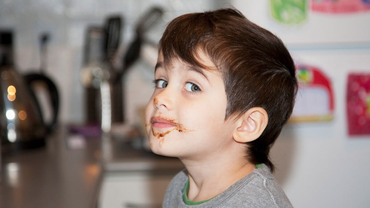 boy with chocolate around mouth