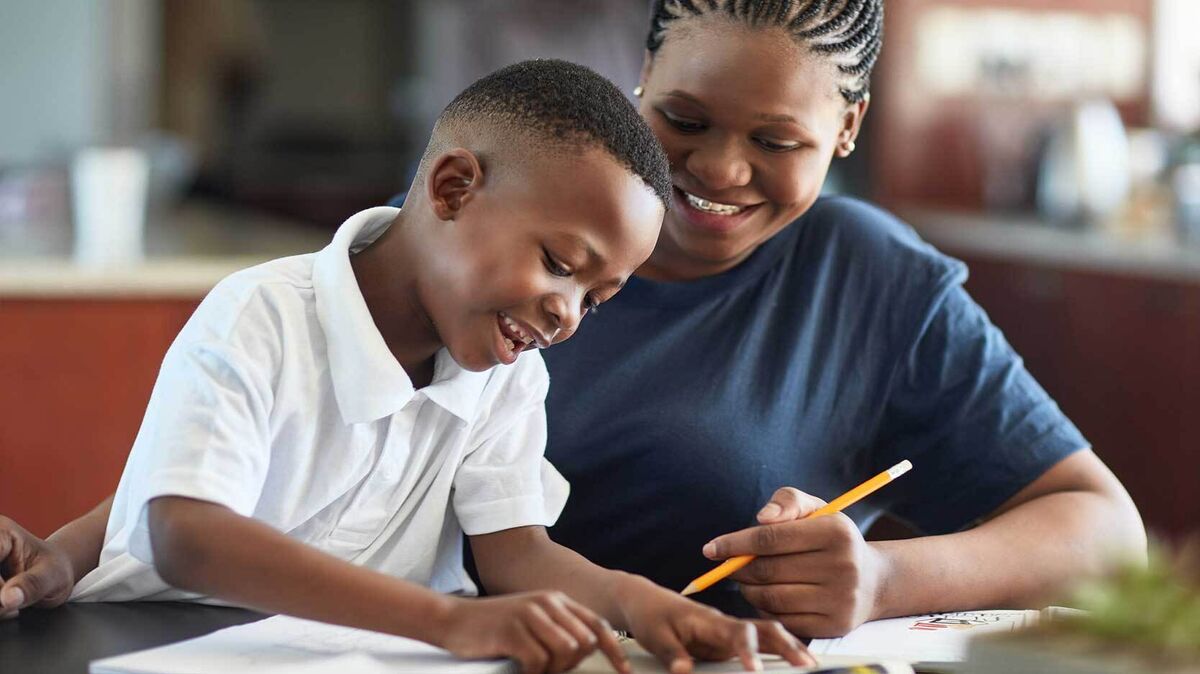 woman teaching 1st grade grammar to student