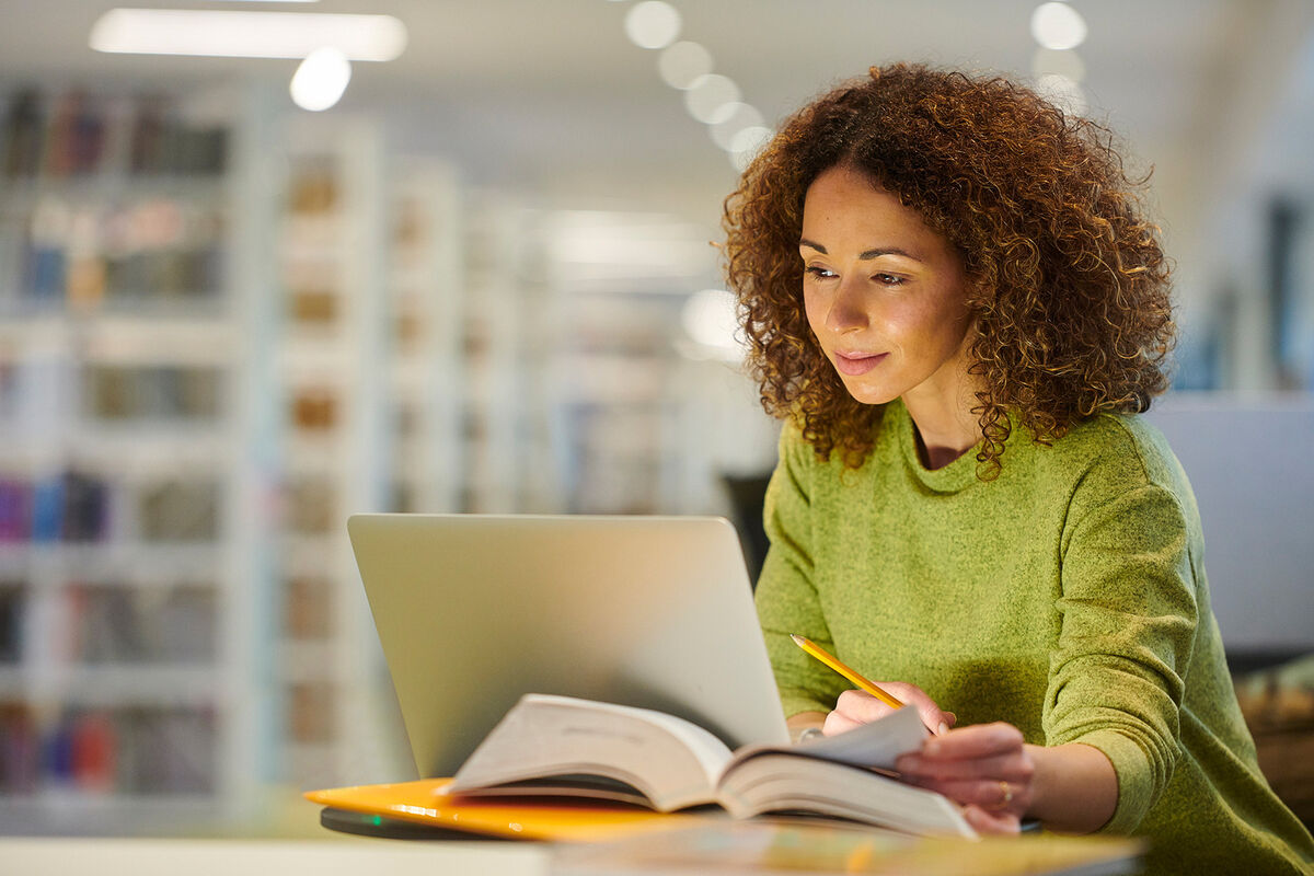 Student in college library