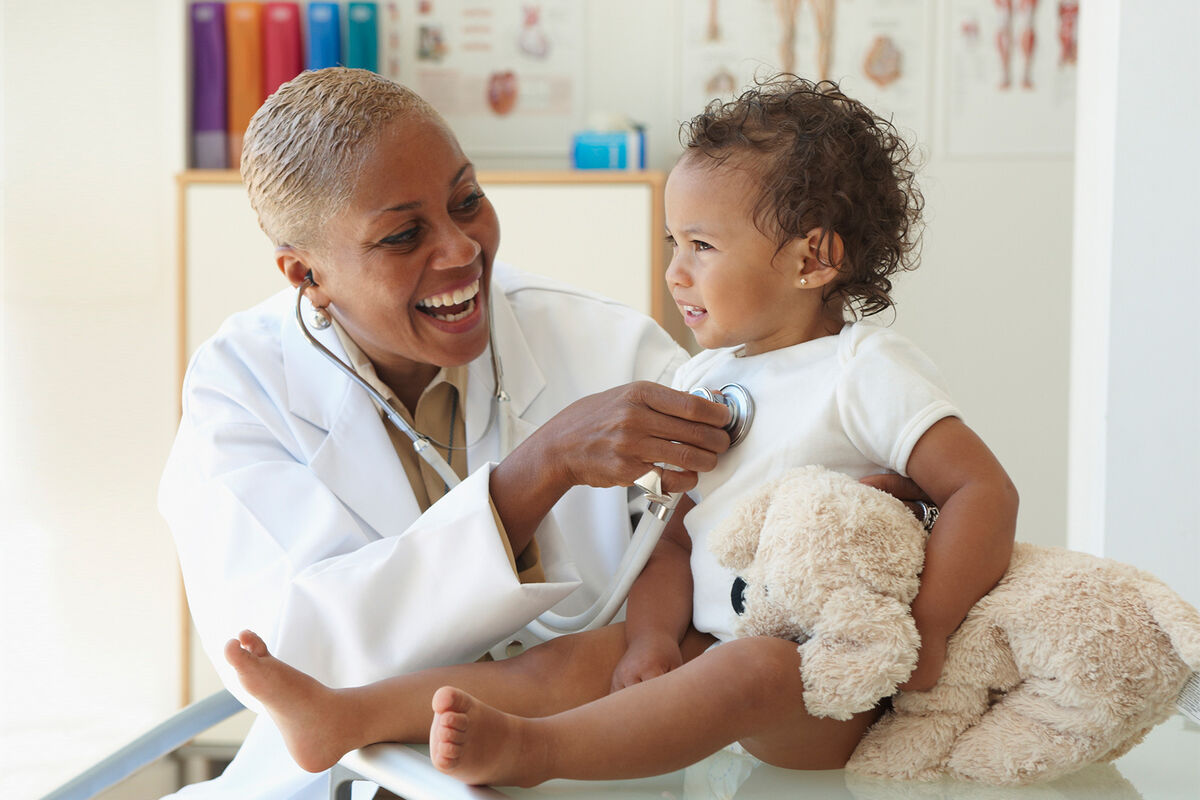 Doctor listening to baby's breathing with stethoscope