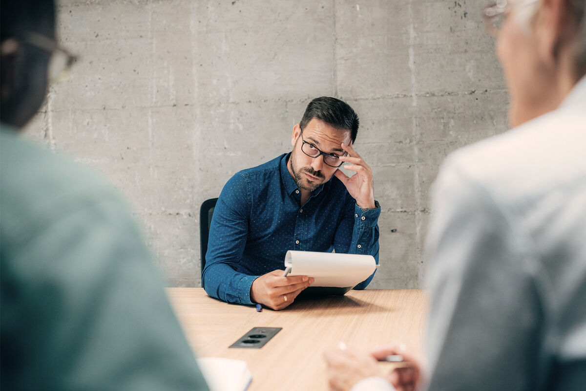 annoyed man in business meeting