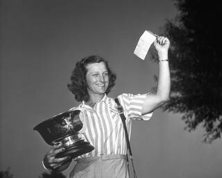 Babe Zaharias with women's national golf trophy
