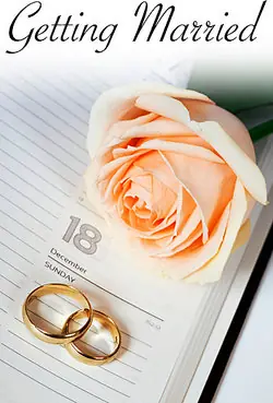 Wedding rings with a rose and calendar as examples of milestones