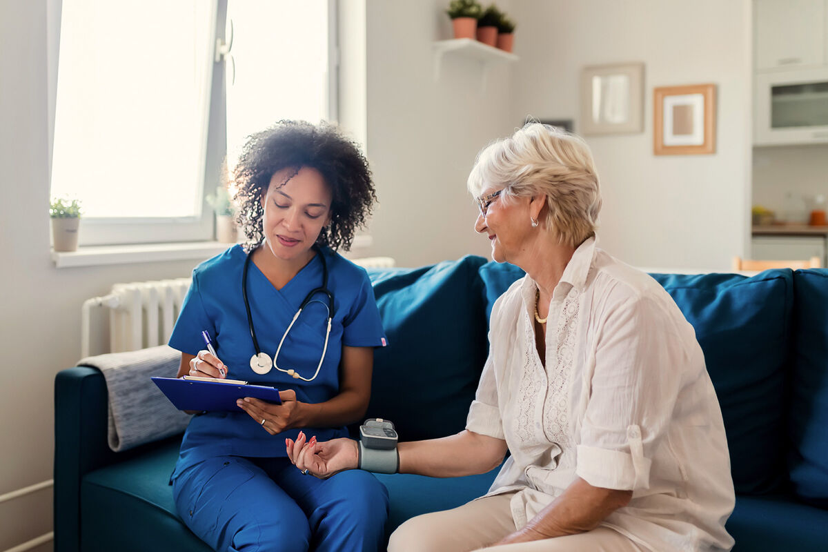 Blood Pressure Measurement of Female Senior Patient by Nurse