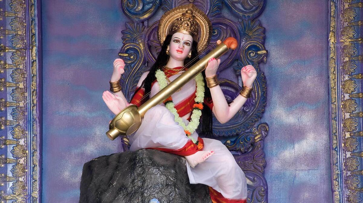 hindu goddess Saraswati playing musical instrument