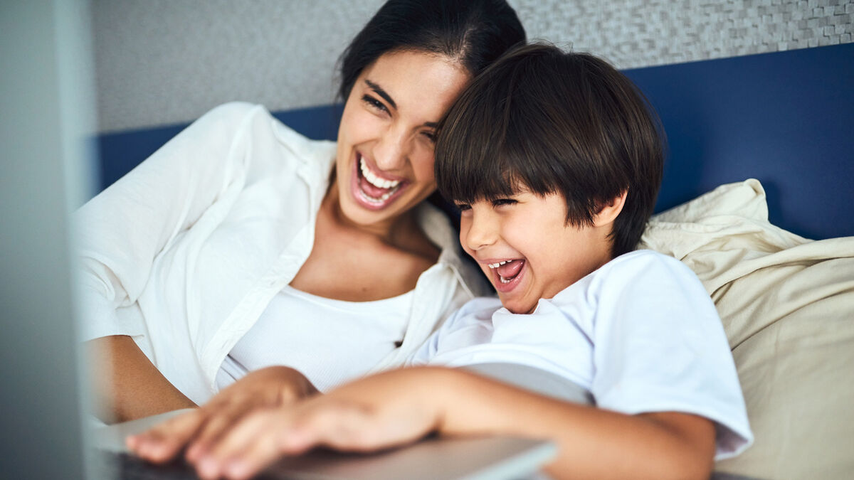 Mother and son laughing at parody