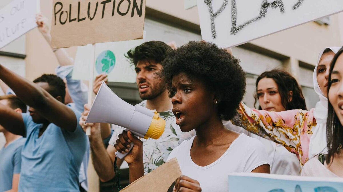 protest march with people holding signs