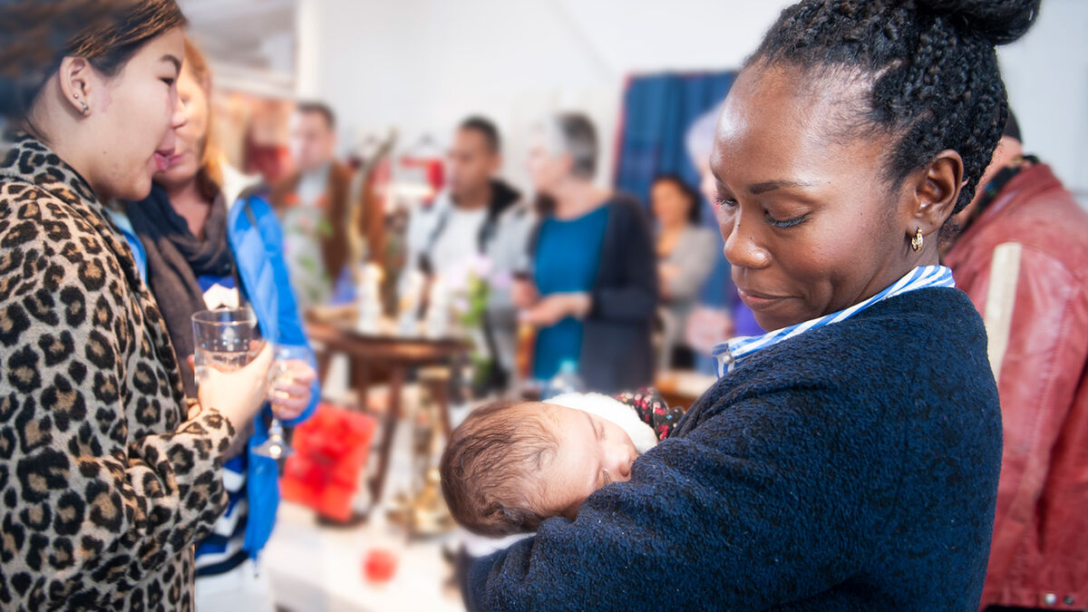 Politician holding baby at fundraiser