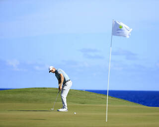 Golfer attempting lag putt