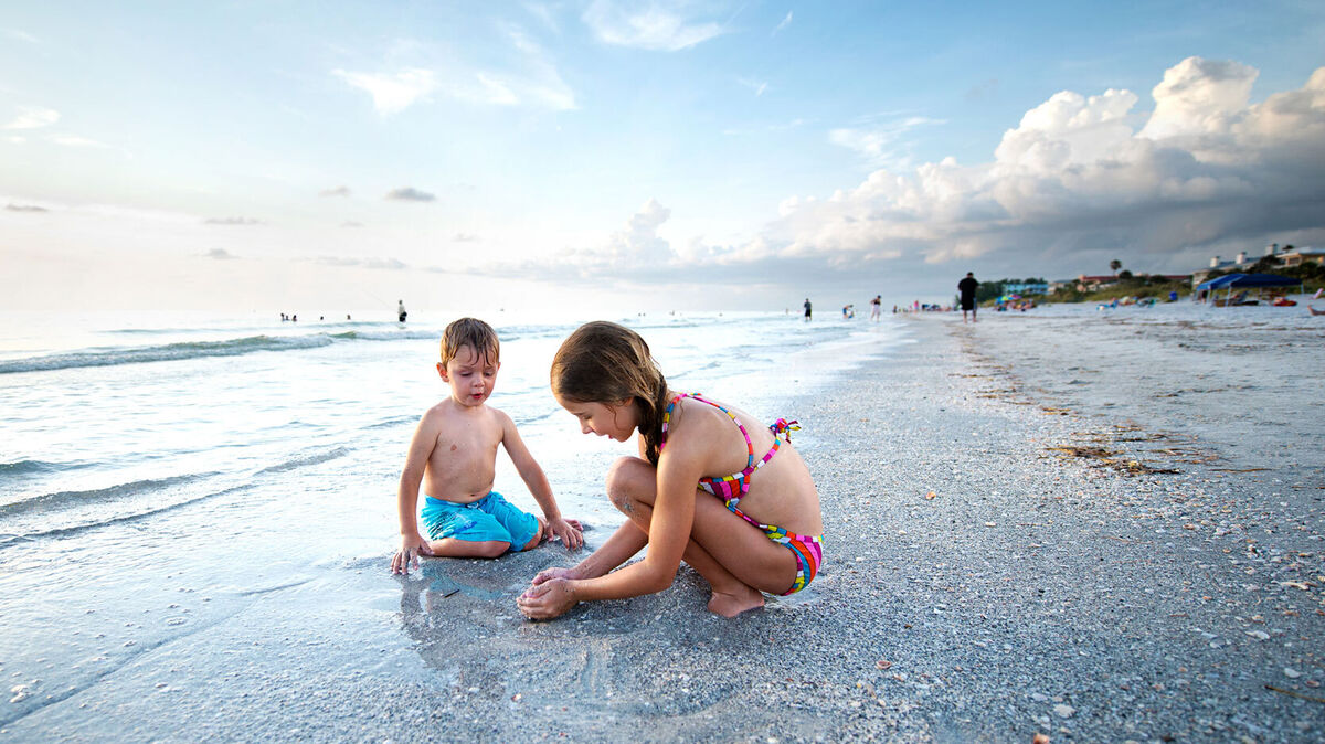 kids playing in sand on Florida beach