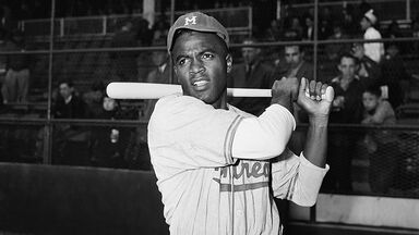 Jackie Robinson swinging bat in 1947