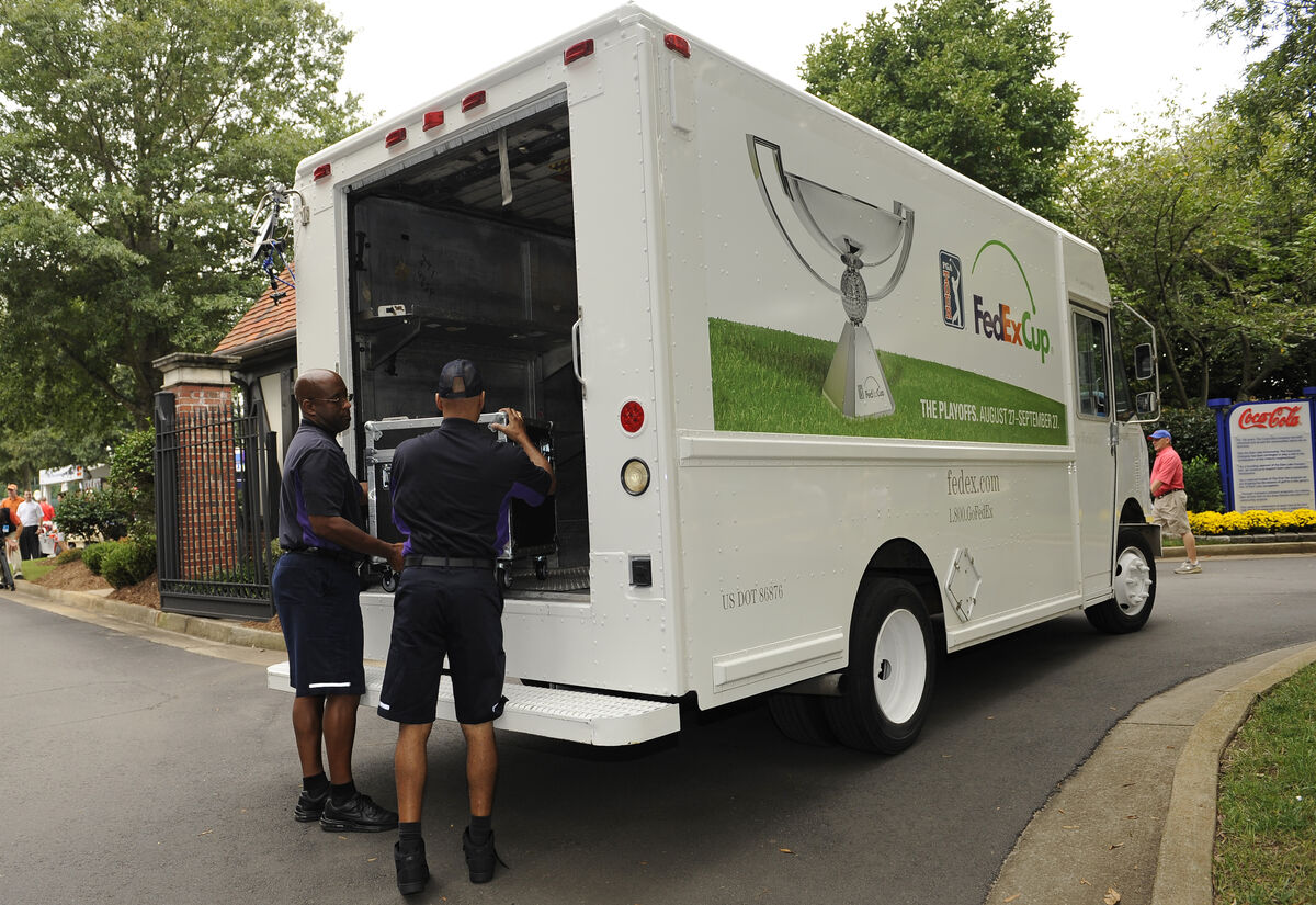 FedEx workers unload at a golf tournament