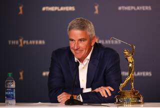 Jay Monahan grins during a press conference
