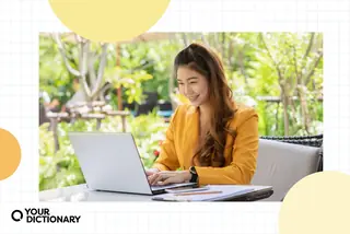 Woman Using Laptop Writing a Reflective Essay