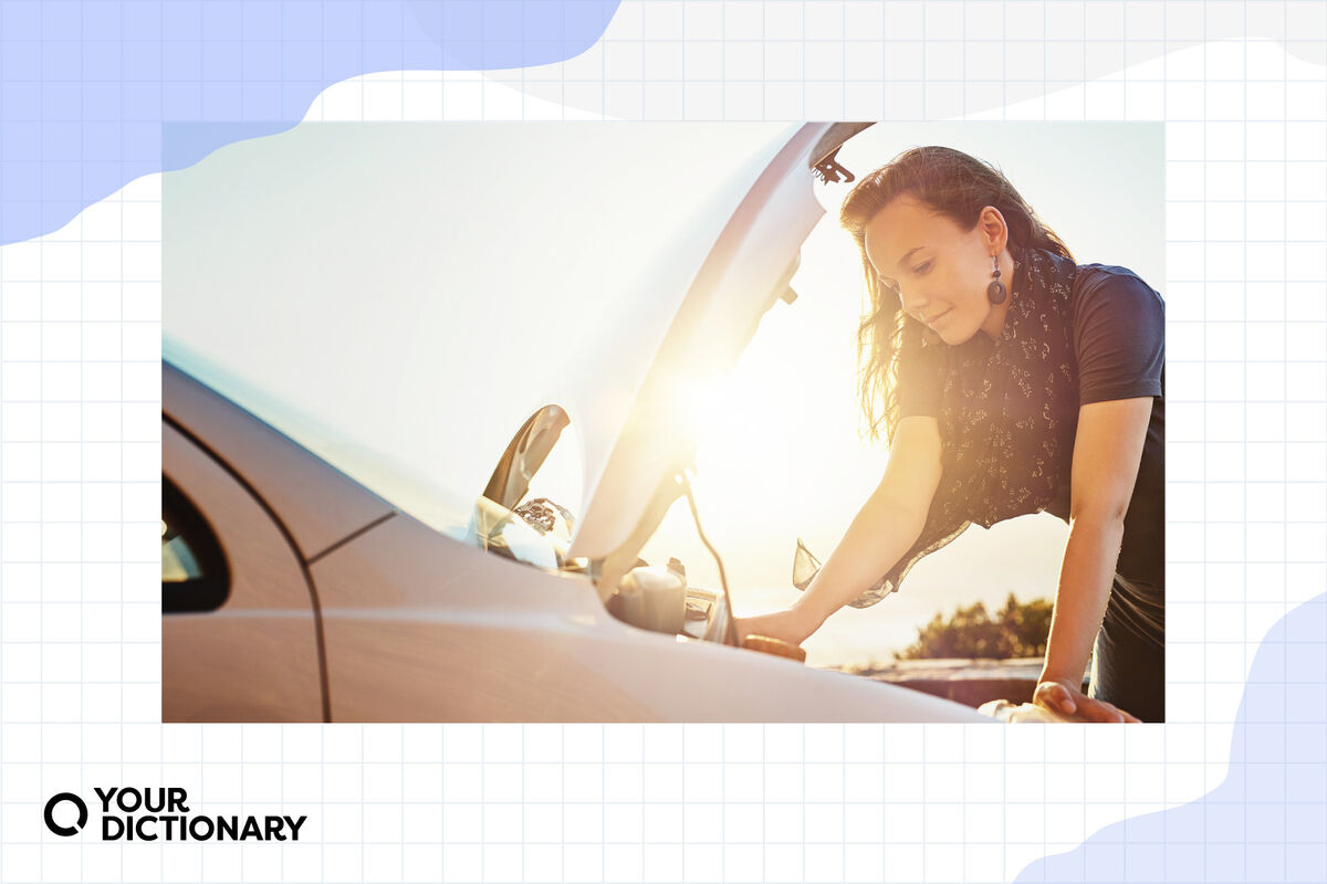 A woman checking the engine of her car.