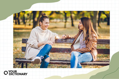 Women talking on bench Women talking on bench