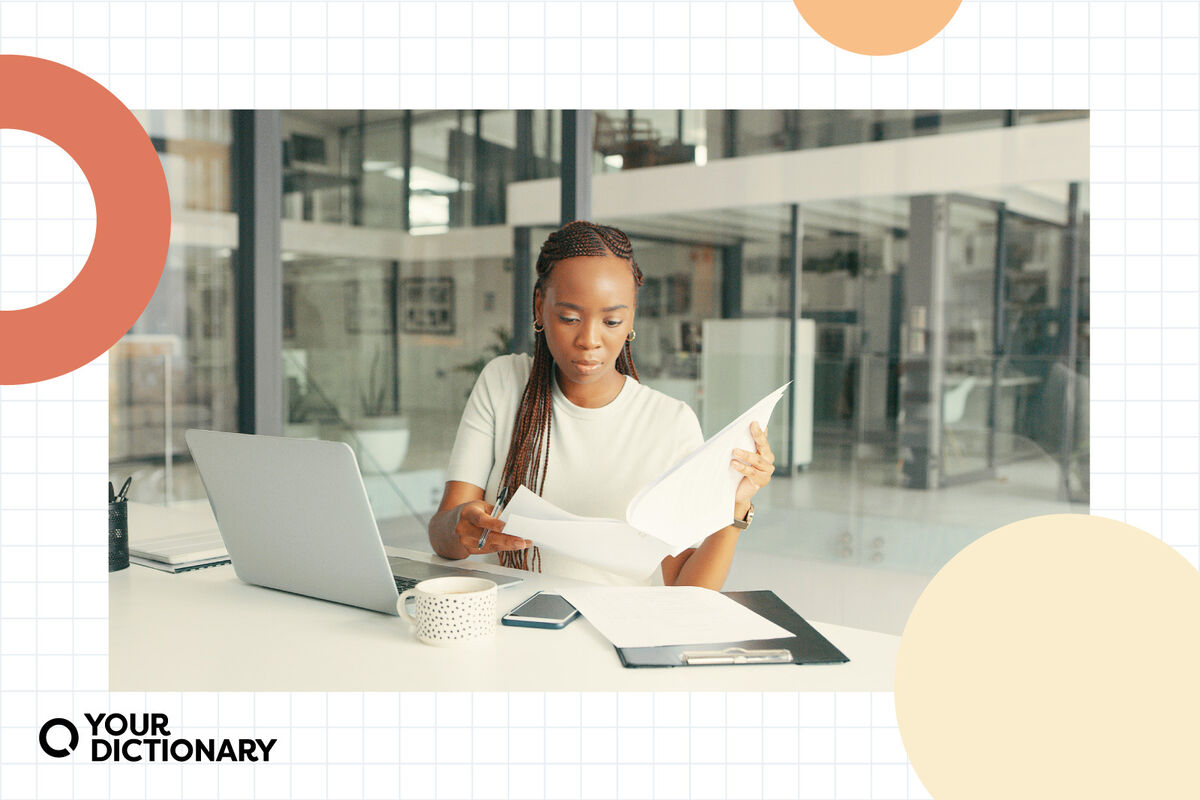 Woman Reading Report in Office