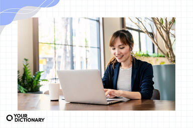 Woman Typing an Essay