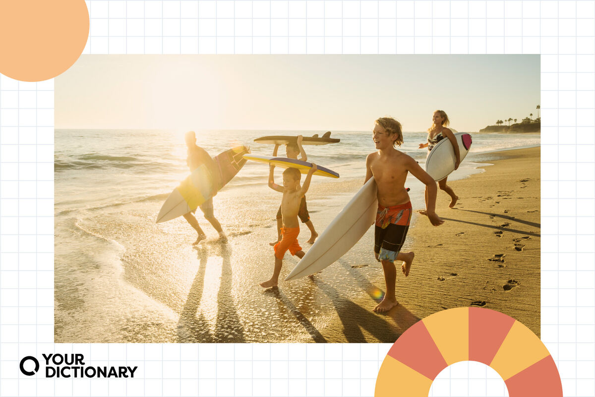 Family with surfboards on beach