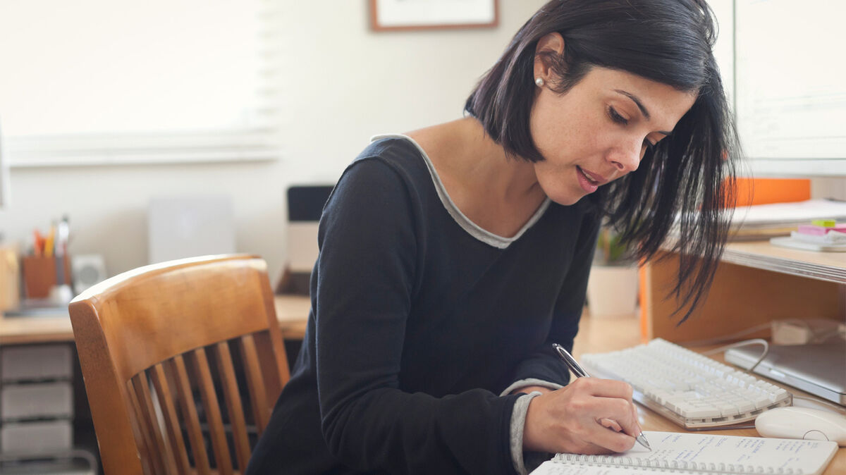 woman writing in journal