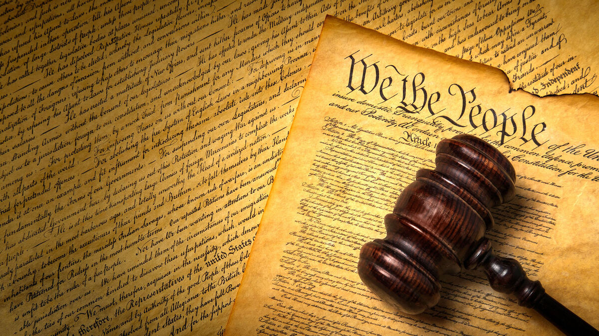 US Constitution with gavel and We the People