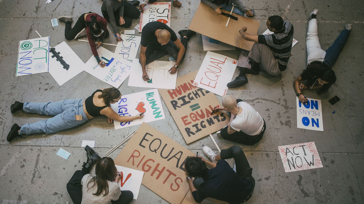 Social justice topics written on signs