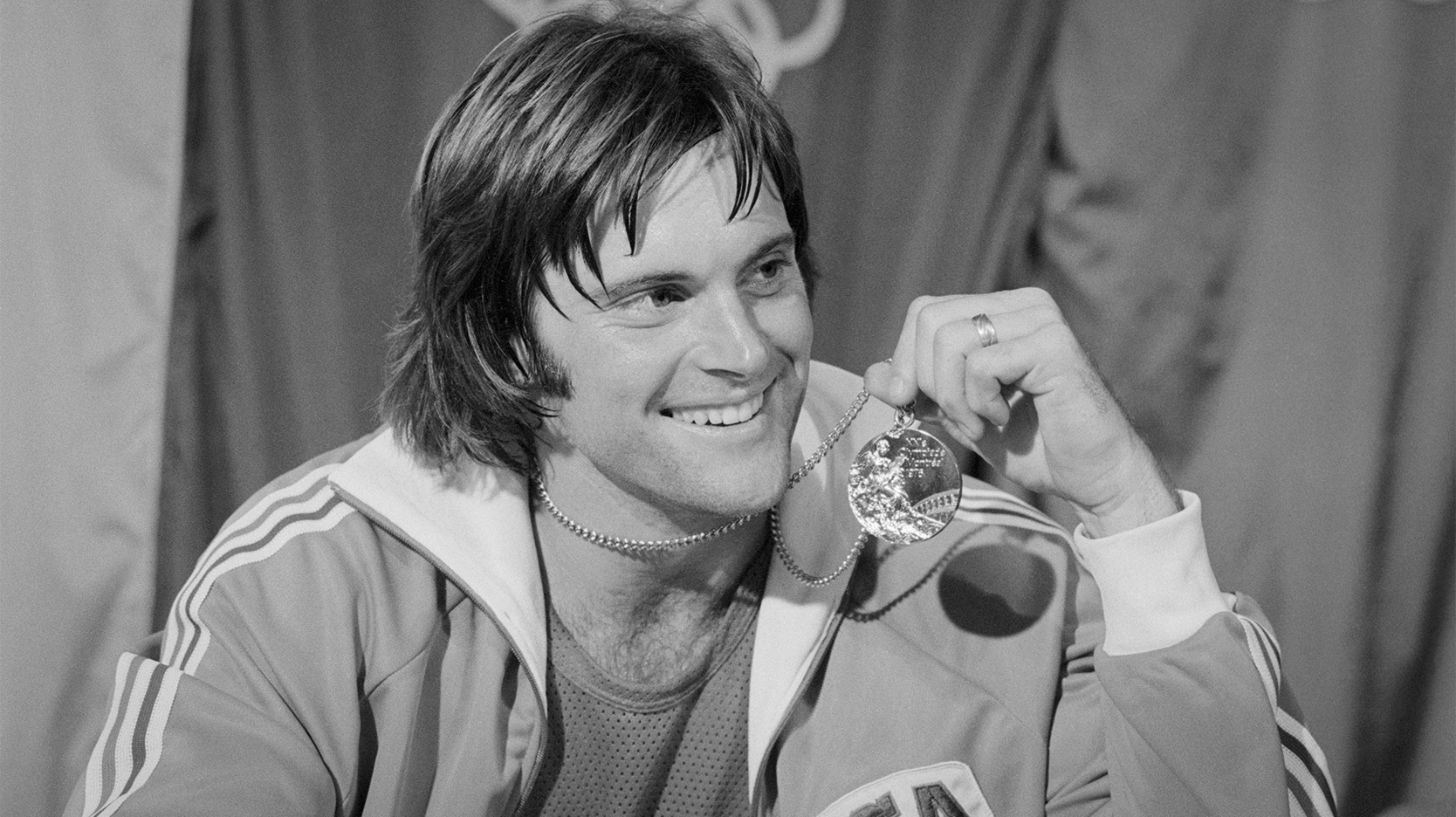 Bruce Jenner holding gold medal 1976 Olympics