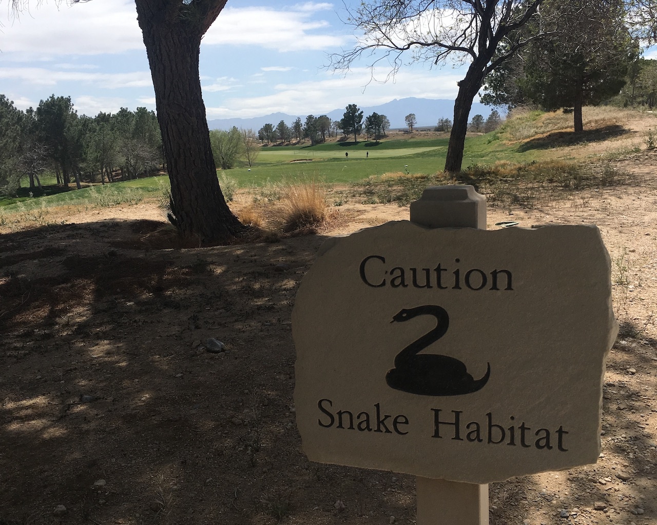 snake habitat sign on golf course