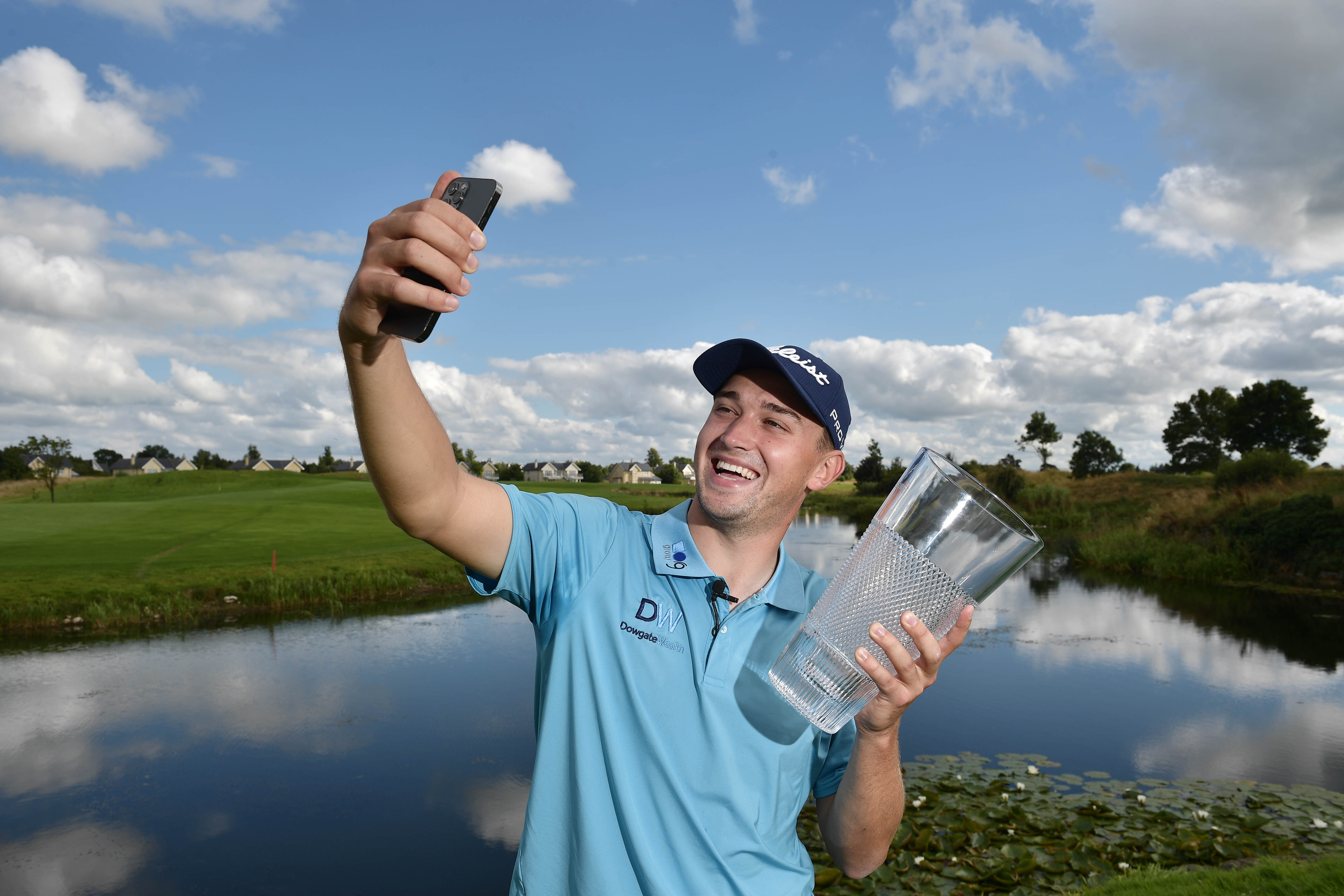 Pro golfer takes a selfie with his trophy