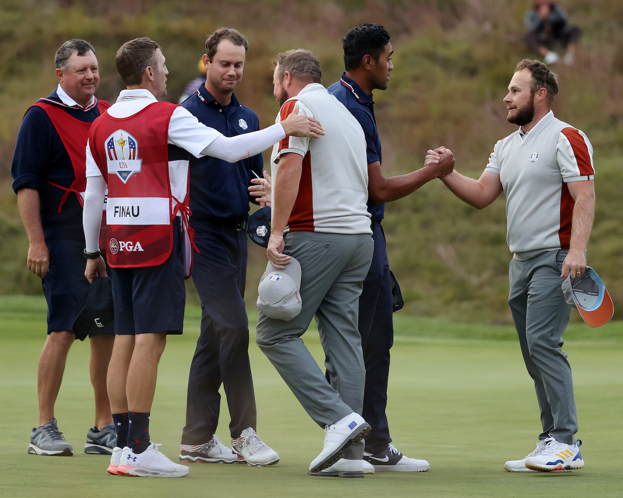 Golfers shaking hands at Ryder Cup