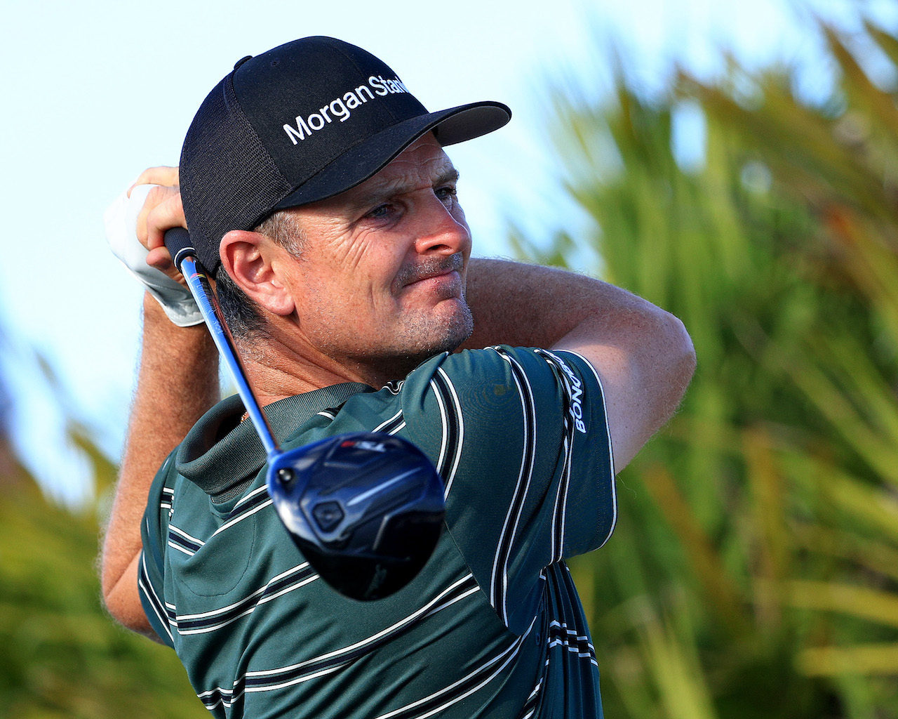 Justin Rose watches swing