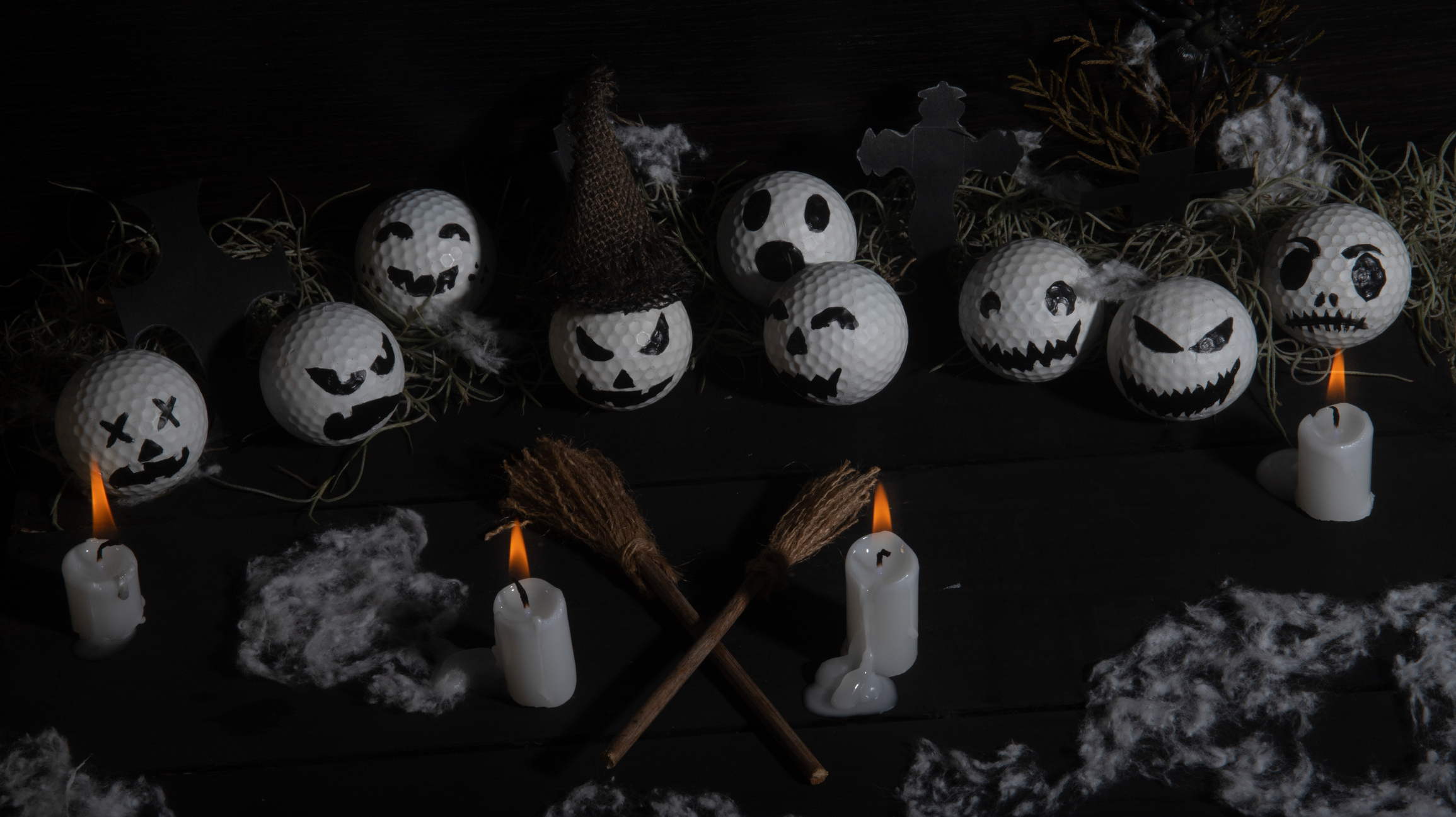 Golf balls with spooky Halloween decorations
