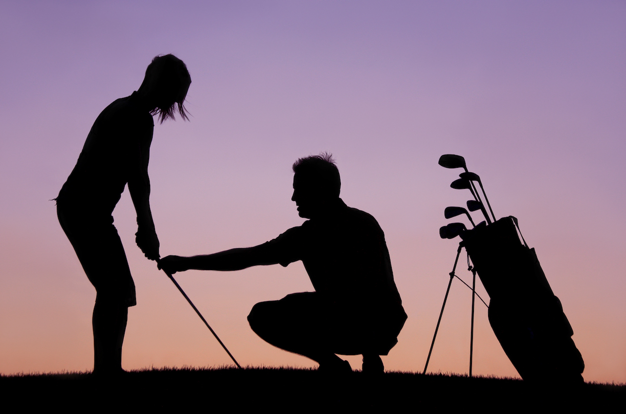 silhouette of golfer practicing swing
