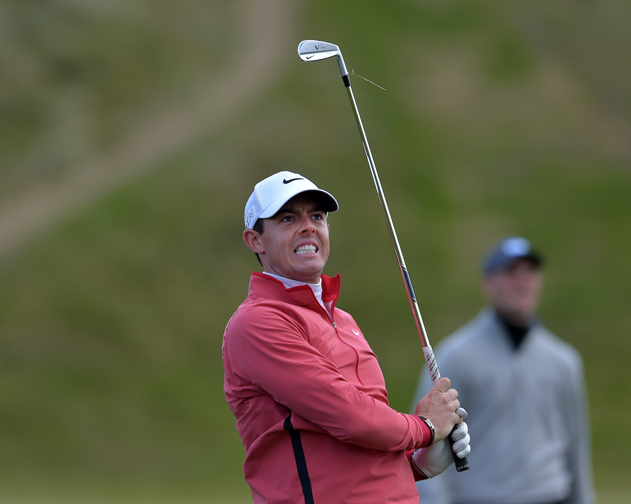 Rory McIlroy grimaces after shot