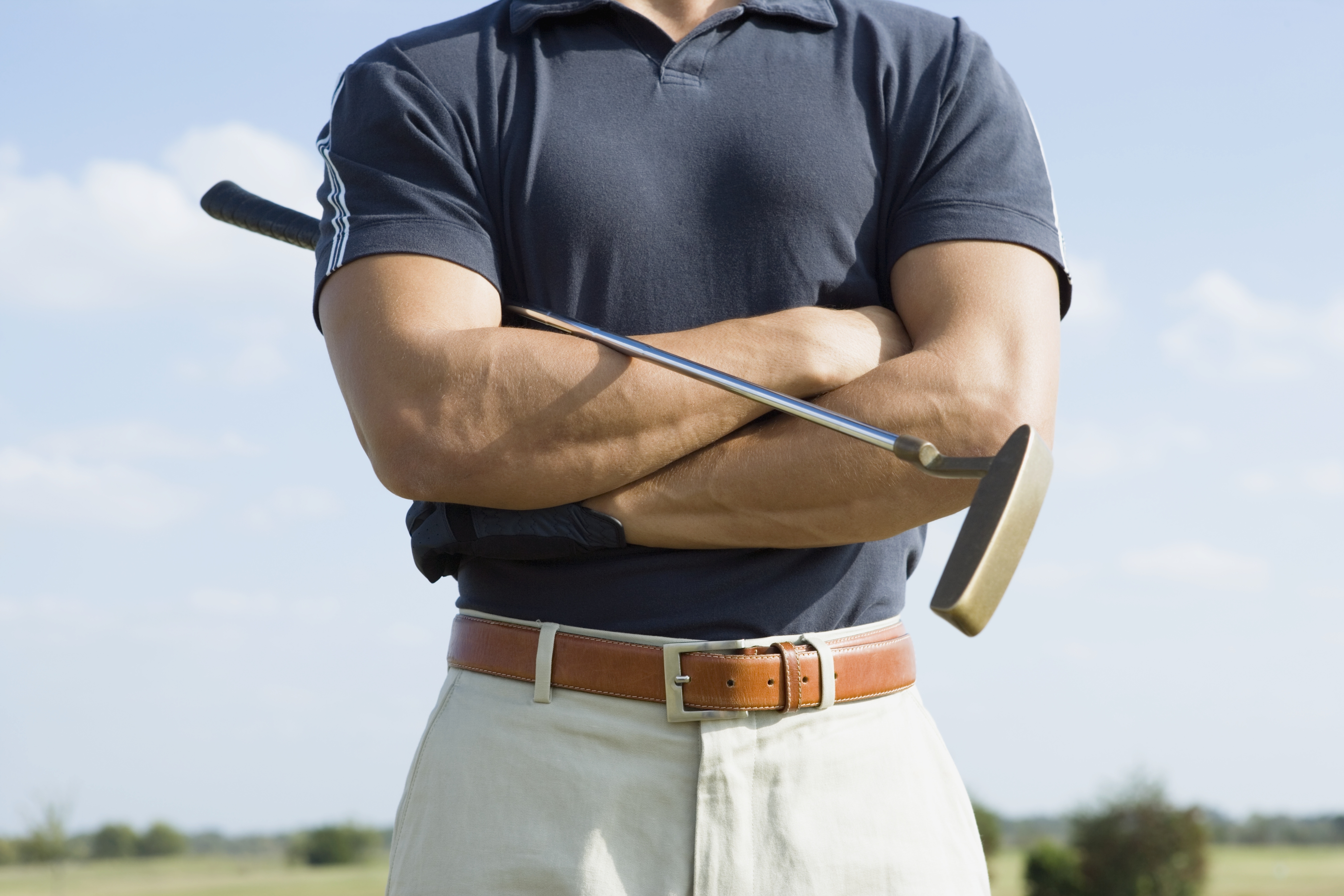 Strong man playing golf