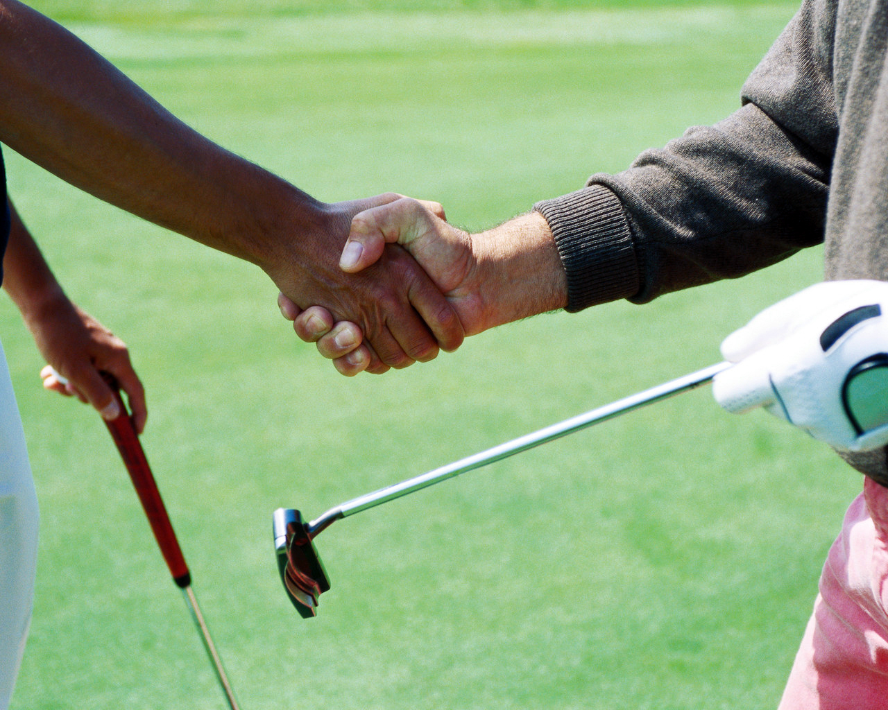 Golfers shaking hands after round