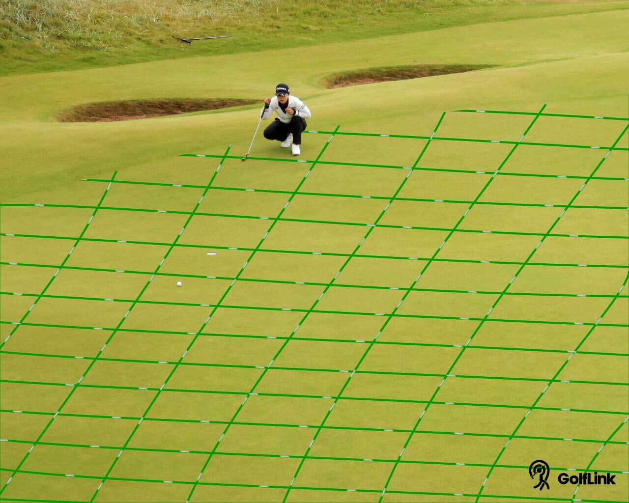 Golfer reading the green